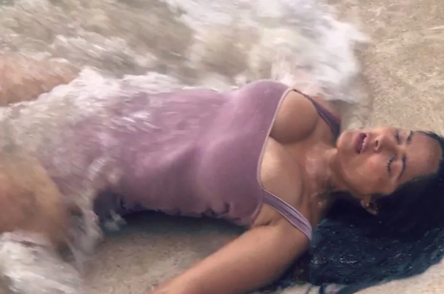 Salma Hayek Lounges on the Sand in Sexy Swimsuit While Letting the Ocean 'Embrace' Her